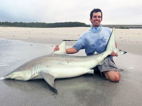 Joshua Jorgensen pictured with a shark. (Courtesy of Joshua Jorgensen)