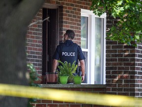 Windsor police investigate after a stabbing on the 1300 block of Dufferin Place, Sunday, July 19, 2015.  A man and woman were taken to hospital with non-life-threatening injuries.  (DAX MELMER/The Windsor Star)