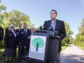 Essex MP, Jeff Watson, is joined members of the Royal Canadian Legion - Riverside Branch 255, at a funding announcement at Sadler's Nature Park in Essex, Friday, July 31, 2015. Watson announced funding for local trails and legion halls. (DAX MELMER/The Windsor Star)