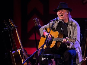 Music legend Neil Young will perform at the DTE Energy Music Theatre on July 14. (Mark Blinch / Canadian Press files)
