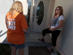 NDP candidate Tracey Ramsey knocks on doors  in Lakeshore while campaigning on Tuesday, August 11, 2015. The NDP is the change people are looking for, Ramsey said. (TYLER BROWNBRIDGE/The Windsor Star)