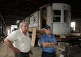 Street Car No. 351, which once operated on the streets and avenues of Windsor, is transported back to The Junction Monday August 10, 2015.  The historic street car was located by Bernard Drouillard, right, and it was purchased by George Sofos, left, and Van Niforos (not shown) owners of The Junction. (NICK BRANCACCIO/The Windsor Star)