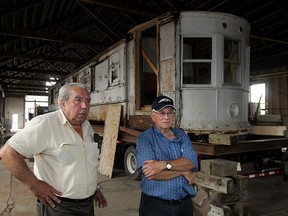 Street Car No. 351, which once operated on the streets and avenues of Windsor, is transported back to The Junction Monday August 10, 2015.  The historic street car was located by Bernard Drouillard, right, and it was purchased by George Sofos, left, and Van Niforos (not shown) owners of The Junction. (NICK BRANCACCIO/The Windsor Star)