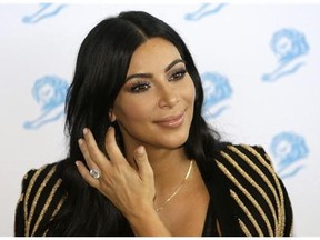 American television personality Kim Kardashian poses for photographers as she attends the Cannes Lions 2015 in Cannes, southern France. The Food and Drug Administration says Kardashian’s social media posts promoting Diclegis, an prescription anti-morning sickness drug, violate federal drug promotion rules because they don’t mention potentially dangerous side effects and drug interactions.. (AP Photo/Lionel Cironneau, File)