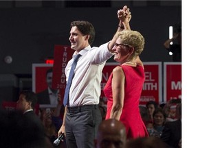 Liberal Leader Justin Trudeau, left, campaigns with Ontario Premier Kathleen Wynne during a stop in Toronto on Monday, August 17, 2015. (Postmedia News files)