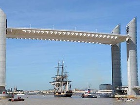The Hermione boat, a replica of the French frigate that transported General Lafayette to America in 1780 to rally US rebels battling for independence, passes under the Jacques-Chaban-Delmas bridge as it arrives in the port of Bordeaux, on August 20, 2015, after a four-month Atlantic voyage.  AFP PHOTO JEAN-PIERRE MULLERJEAN-PIERRE MULLER/AFP/Getty Images