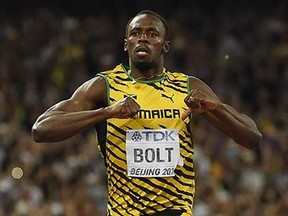 Jamaica's Usain Bolt celebrates after winning the final of the men's 200 metres athletics event at the 2015 IAAF World Championships at the "Bird's Nest" National Stadium in Beijing on August 27, 2015. AFP PHOTO / OLIVIER MORINOLIVIER MORIN/AFP/Getty Images