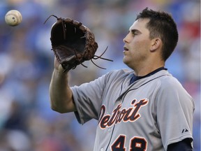 Detroit Tigers starting pitcher Matt Boyd catches the ball from a teammate before facing a Kansas City Royals batter during the first inning of a baseball game at Kauffman Stadium in Kansas City, Mo., Monday, Aug. 10, 2015. Boyd gave up three runs in the inning. (AP Photo/Orlin Wagner)