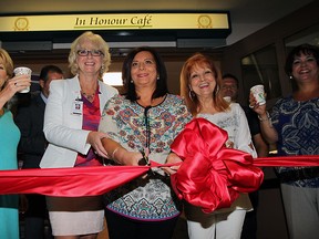 Shari Cunningham, left, Janice Kaffer, Anita Imperiolli, Teresa Silvestri and Marie Campagna, right, prepare to cut the ribbon and enjoy a cup of coffee at In Honour Cafe located in Dr. Y. Emara Centre for Healthy Aging and Mobility at Hotel-Dieu Grace Healthcare on Prince Road. (NICK BRANCACCIO/The Windsor Star)