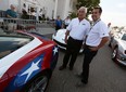 Roger Penske and Sam Hornish Jr. (right) chat after a dream cruise by Penske drivers in 16 pace cars which represented the 16 Indianapolis 500 victories for Penske drivers on Woodward Avenue in Royal Oak on Thursday, August 13, 2015.                        (TYLER BROWNBRIDGE/The Windsor Star)