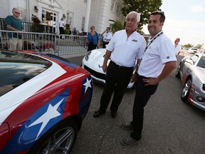 Roger Penske and Sam Hornish Jr. (right) chat after a dream cruise by Penske drivers in 16 pace cars which represented the 16 Indianapolis 500 victories for Penske drivers on Woodward Avenue in Royal Oak on Thursday, August 13, 2015.                        (TYLER BROWNBRIDGE/The Windsor Star)