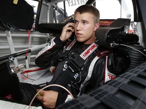 Cameron Hayley, driver of the #13 Carolina Nut/Cabinets by Hayley Toyota, prepares to drive during practice for the NASCAR Camping World Truck Series Careers for Veterans 200 at Michigan International Speedway on August 14, 2015 in Brooklyn, Michigan.  (Photo by Gregory Shamus/Getty Images)