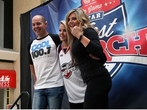 Finalists Jay Stevens (left) and Sarah Ryrie (right) pose for a photo with current host Erika Harnish during the quest for a new Spitfires in game host at the Devonshire Mall in Windsor on Saturday, August 15, 2015.                          (TYLER BROWNBRIDGE/The Windsor Star)