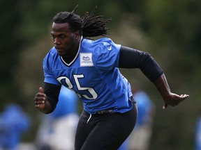 Detroit Lions running back Joique Bell runs during NFL football training camp in Allen Park, Mich., Friday, Aug. 7, 2015.  (AP Photo/Paul Sancya)