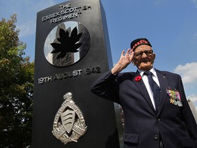 Pte. Leslie Tetler, 95, the last known member of The Essex Scottish Regiment who fought on Red Beach during Operation Jubilee in Dieppe, France, salutes during a ceremony at Windsor's Dieppe Park August 19, 2015.  Amazingly, Tetler survived three years as a prisoner of war, and three, failed escape attempts.  (NICK BRANCACCIO/The Windsor Star)