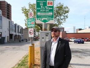 City of Windsor councillor Chris Holt stands at the city-owned pay-and-display lot behind the downtown Windsor Public Library in Windsor, Ontario. (JASON KRYK/The Windsor Star)