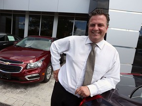 Jay Jamieson is photographed with a new Chevrolet Cruz at Dan Kane in Windsor on Thursday, August 24, 2015. (TYLER BROWNBRIDGE/The Windsor Star)