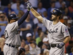 Detroit Tigers' Daniel Norris, right, celebrates with Rajai Davis after hitting a two-run home run against the Chicago Cubs during the second inning of a baseball game Wednesday, Aug. 19, 2015, in Chicago. (AP Photo/Nam Y. Huh)