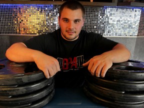 High school powerlifting champion Luke Tremblay takes a break at Beachwalk Family Fitness. (NICK BRANCACCIO/The Windsor Star)