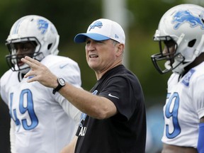 Detroit Lions linebackers coach Bill Sheridan directs his players during a drill at the team's football training facility, Monday, Aug. 24, 2015, in Allen Park, Mich. (AP Photo/Carlos Osorio)