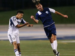 University of Windsor Lancers Brendan Teeling, left and  Ciociaro's Greig McKenzie go up for the soccer ball during exhibition soccer action at Alumni Field in Windsor, Ontario on August 25, 2015. (JASON KRYK/The Windsor Star)