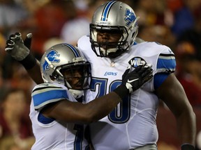 Jeremy Ross #12 of the Detroit Lions celebrates with Michael Williams #73 of the Detroit Lions during a preseason game at FedEx Field on August 20, 2015 in Landover, Maryland.  (Photo by Matt Hazlett/Getty Images)