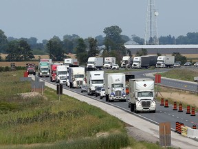 Traffic backs up on Highway 401 near Merlin Road in Chatham-Kent after a truck mva in the construction zone - east of Tilbury.  Construction continues on 401 east of Tilbury to Chatham-Kent. (JASON KRYK/The Windsor Star)
