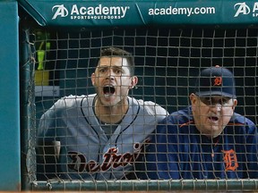 Ian Kinsler, left, of the Detroit Tigers yells at home plate umpire Doug Eddings from the dugout as bench coach Gene Lamont looks on in the seventh inning after Jose Iglesias was called out on strikes at Minute Maid Park on August 16, 2015 in Houston, Texas. Kinsler was thrown out of the game.  (Photo by Bob Levey/Getty Images)