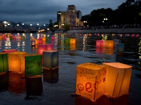 In this file photo, paper lanterns float in the Motoyasu River in front of the Atomic Bomb Dome (background) at the Peace Memorial Park in Hiroshima on Aug. 6, 2014.  The Japanese western city marked the 70th anniversary of the world's first atomic attack.  AFP PHOTOTORU YAMANAKA/AFP/Getty Images