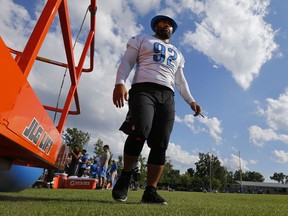 Detroit Lions cornerback Rashean Mathis dives during a drill at NFL football training camp in Allen Park, Mich., Tuesday, Aug. 4, 2015.  (AP Photo/Paul Sancya)