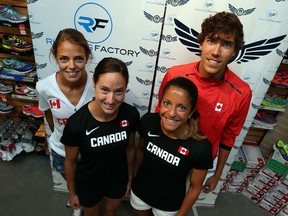 Local runners Melissa Bishop, from left, Noelle Montcalm, Nicole Sassine and Corey Bellemore make a stop at the Running Factory in Windsor before heading out to various meets around the world Tuesday.(TYLER BROWNBRIDGE/The Windsor Star)
