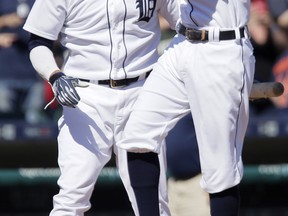 Ian Kinsler #3 of the Detroit Tigers celebrates with Victor Martinez #41 after hitting a walk-off home run to drive in Jose Iglesias and defeat the Kansas City Royals 8-6 in the ninth inning at Comerica Park on August 6, 2015 in Detroit, Michigan. (Photo by Duane Burleson/Getty Images)