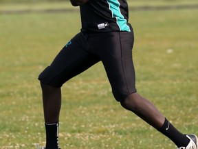 Essex County Ravens Lowhya Lako, a defensive end, shows his ball hawking skills at Villanova High School Athletic Field Tuesday July 28, 2015.  (NICK BRANCACCIO/The Windsor Star)