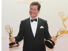 File: Colbert Report host Stephen Colbert celebrates Emmys for best writing for a variety series and best variety series.
(FREDERIC J. BROWN , AFP/Getty Images)