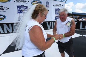 Dave and Karen Hastings renewed their wedding vows Saturday at Michigan international Speedway as MIS president Roger Curtis officiated over the ceremony.