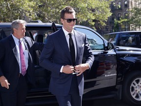 New England Patriots quarterback Tom Brady arrives at federal court, Wednesday, Aug. 12, 2015, in New York. Brady and NFL Commissioner Roger Goodell are set to explain to a judge why a controversy over underinflated footballs at last season's AFC conference championship game is spilling into a new season. (AP Photo/Mary Altaffer)