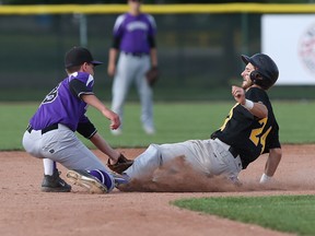 Tecumseh Thunder's Jared Fuerth tags out Essex Yellowjackets baserunner, Chris Bondy at second base during action at Cullen Field in Windsor, Ontario on August 7, 2015 . (JASON KRYK/The Windsor Star)