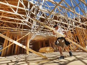 Builder Doug Couvillon works on a home in the 2200 block of Gatwick Avenue on Friday, Aug. 7, 2015, in Windsor, Ont. Residential building permits are up for the first time in years. (DAN JANISSE/The Windsor Star)