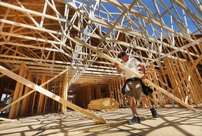 Builder Doug Couvillon works on a home in the 2200 block of Gatwick Avenue on Friday, Aug. 7, 2015, in Windsor, Ont. Residential building permits are up for the first time in years. (DAN JANISSE/The Windsor Star)