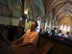 Organist Peter St. Amour plays the pipe organ at Assumption Church after it was opened for a three-hour open house in Windsor on Saturday, August 15, 2015. The church was closed and has not allowed the public inside since November 2014.  (TYLER BROWNBRIDGE/The Windsor Star)