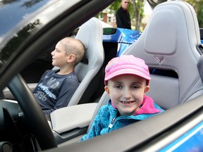 Abbey Sauve, 7, gets behind the wheel of a corvette at Windsor Regional Hospital in Windsor, Ont. on Wednesday, Aug. 26, 2015. The Corvette Club of Windsor rolled out their muscle cars for the sick children and donated $4,000 to Windsor Regional Hospital's pediatric oncology satellite unit. (DYLAN KRISTY/The Windsor Star)