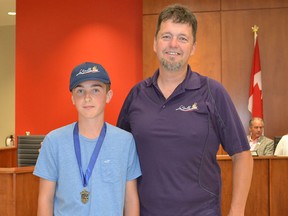 Shayne O’Dwyer, left, was presented with a citizen award by LaSalle coun. Jeff Renaud at the Tuesday, Aug. 11 council meeting. O’Dwyer, 13, raised $3,000 for MS during this year’s fundraising ride from Grand Bend to London and back. It was the sixth year he rode in the event. (JULIE KOTSIS/The Windsor Star)