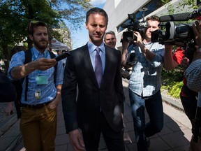 Nigel Wright, former Chief of Staff to Prime Minister Stephen Harper, leaves the courthouse in Ottawa after his second day of testimony at the trial of former Conservative Senator Mike Duffy on Thursday, August 13, 2015. Duffy is facing 31 charges, including fraud, breach of trust and bribery related to inappropriate Senate expense claims. THE CANADIAN PRESS/Justin Tang