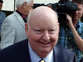 Former Conservative Senator Mike Duffy leaves the courthouse in Ottawa on Friday, August 14, 2015. Duffy is facing 31 charges, including fraud, breach of trust and bribery. THE CANADIAN PRESS/Fred Chartrand