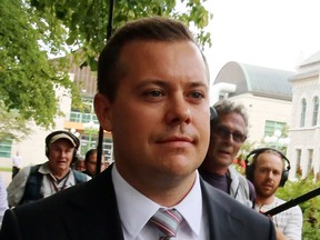 Chris Woodcock, the former director of issues management inside the PMO, leaves the Ottawa courthouse after testifying at former Conservative senator Mike Duffy's trial in Ottawa, Monday August 24, 2015. THE CANADIAN PRESS/Fred Chartrand