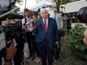 Sen. Mike Duffy, a former Conservative caucus member, leaves the courthouse in Ottawa, following the second day of testimony by Chris Woodcock, former director of issues management in the Prime Minister's Office, on Tuesday, Aug. 25, 2015. The trial is expected to break until November. THE CANADIAN PRESS/Justin Tang