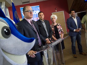 Mayor Drew Dilkens speaks at a press conference where Essex MP Jeff Watson, centre, announced funding in the amount of $3.5 million for the FINA world diving championships, Saturday, August 1, 2015.    (DAX MELMER/The Windsor Star)