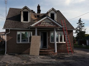 The Pabla Law Office is seen after an overnight fire in Windsor on Thursday, Aug. 6, 2015.                          (TYLER BROWNBRIDGE/The Windsor Star)