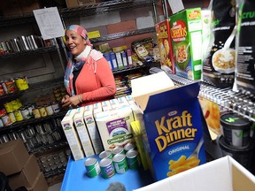 Remy Boulbol leads a tour of the food bank at the Welcome Centre Shelter in Windsor on Thursday, Aug. 6, 2015. The shelter is hosting a cooking contest that will feature only items from the food bank. (TYLER BROWNBRIDGE/The Windsor Star)