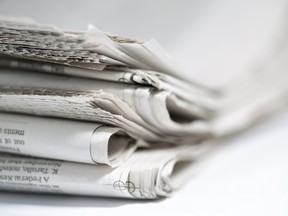 Newspapers folded and stacked. Photo by fotolia.com